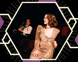 Person in a sequined gold dress seated in a theater with another person in the background playing a saxophone, framed by a geometric hexagon design.